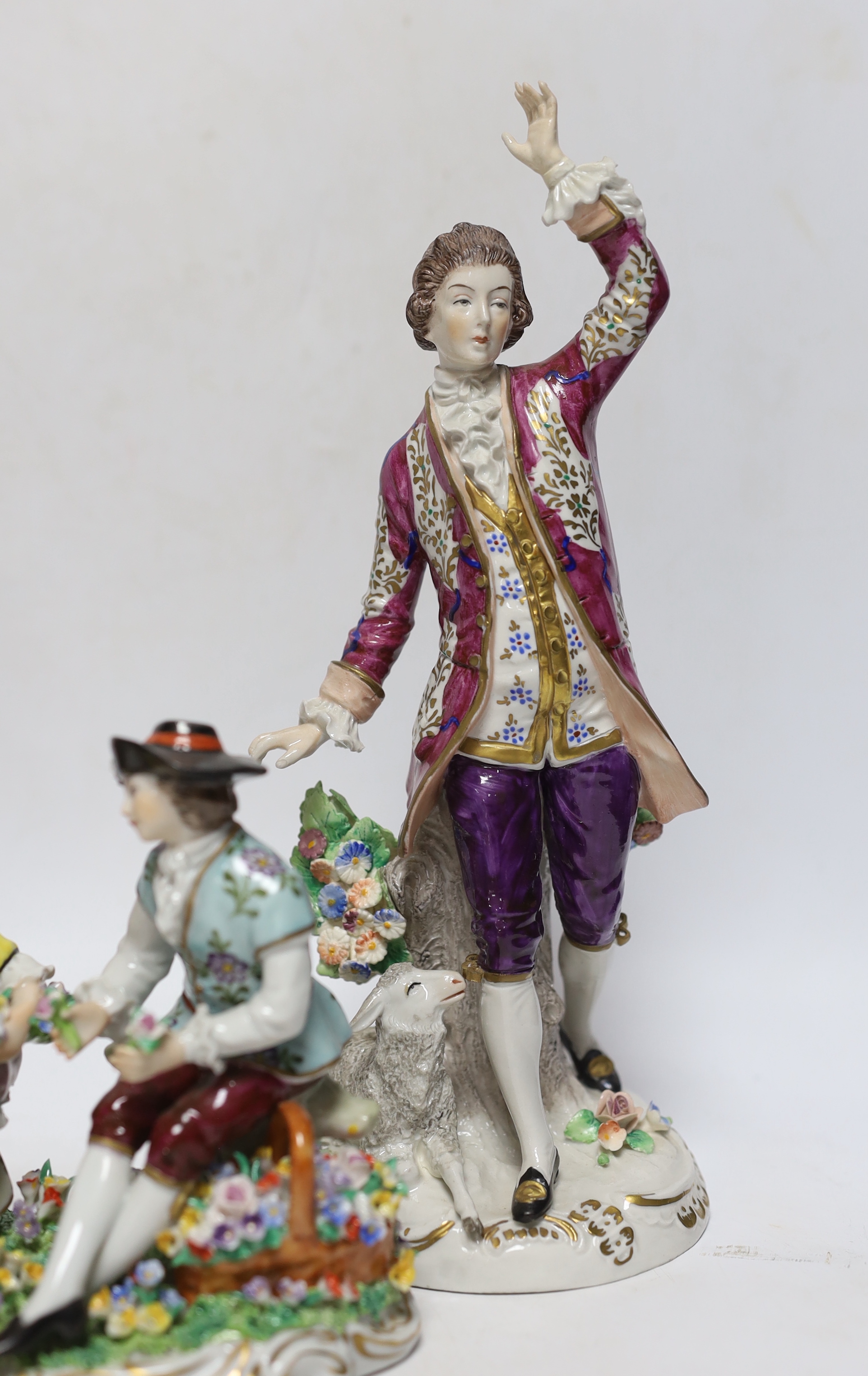 Four Sitzendorf porcelain figures in groups, early 20th century, 26cm